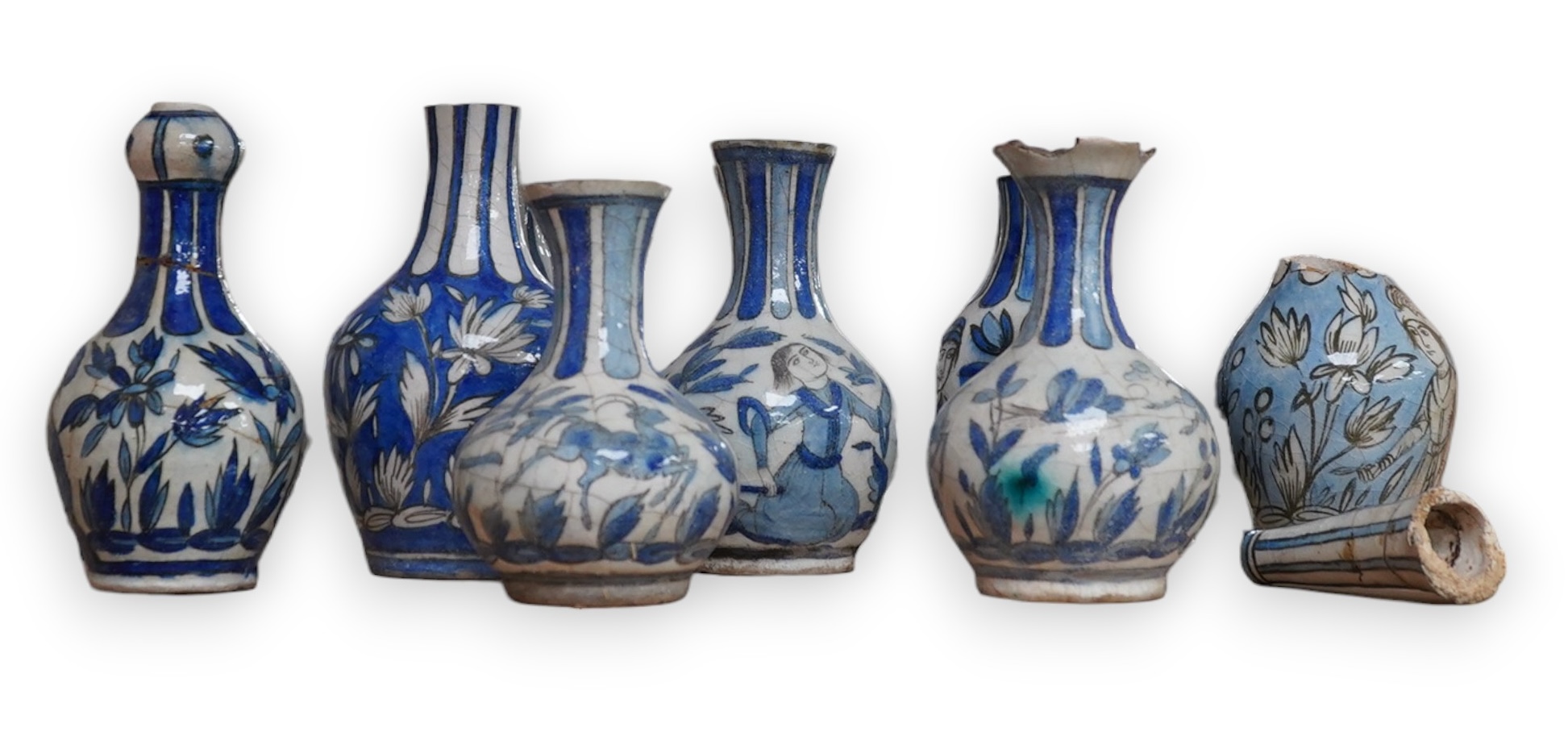 A large collection of Persian, predominantly blue and white, guglets, 18th century, largest 21.5cm. Condition - mostly damaged